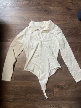 Moving must sell: Women’s Long Sleeve Polo Bodysuit in Cream